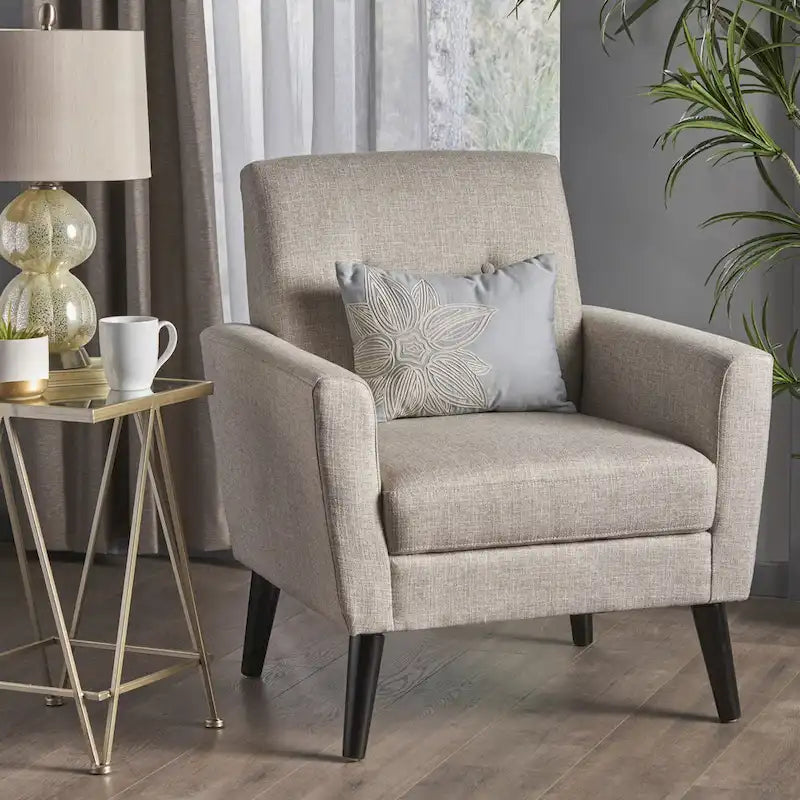 Fauteuil club capitonné avec pieds en caoutchouc