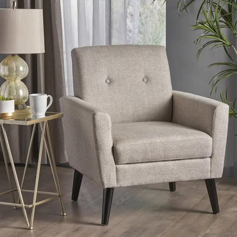 Fauteuil club capitonné avec pieds en caoutchouc